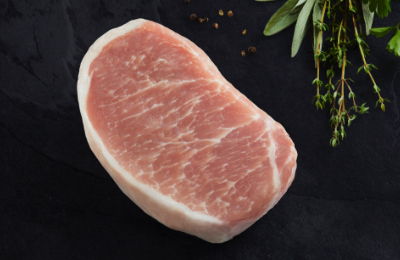 CR_pork_chop A single pork chop on a black background